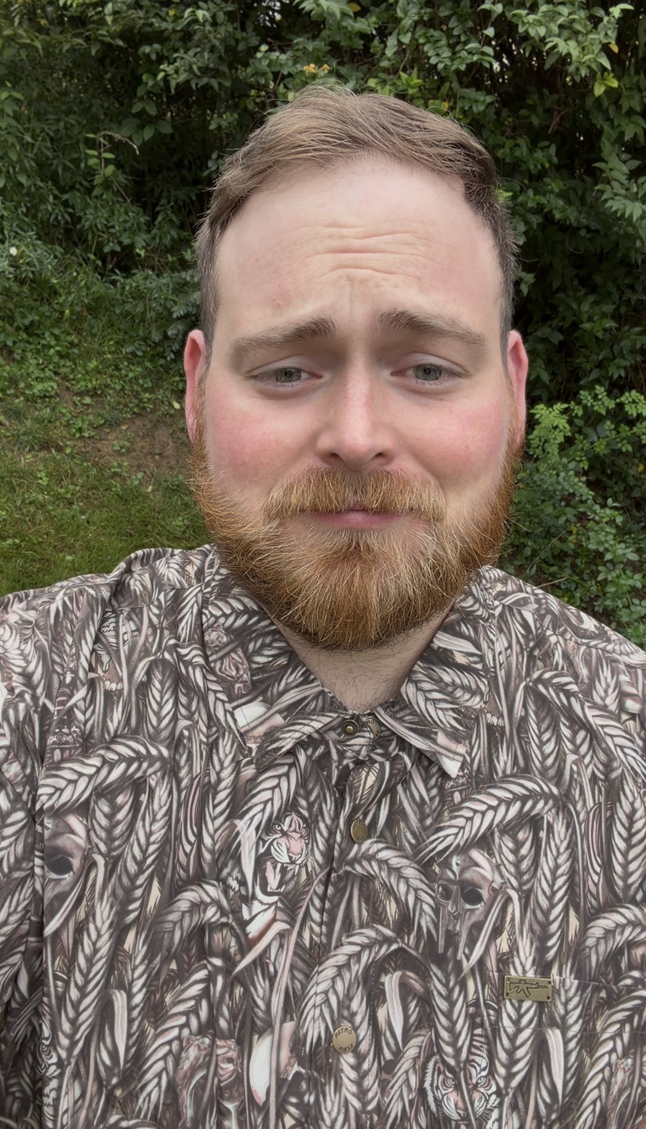 Jay Makes outdoors wearing a patterned shirt